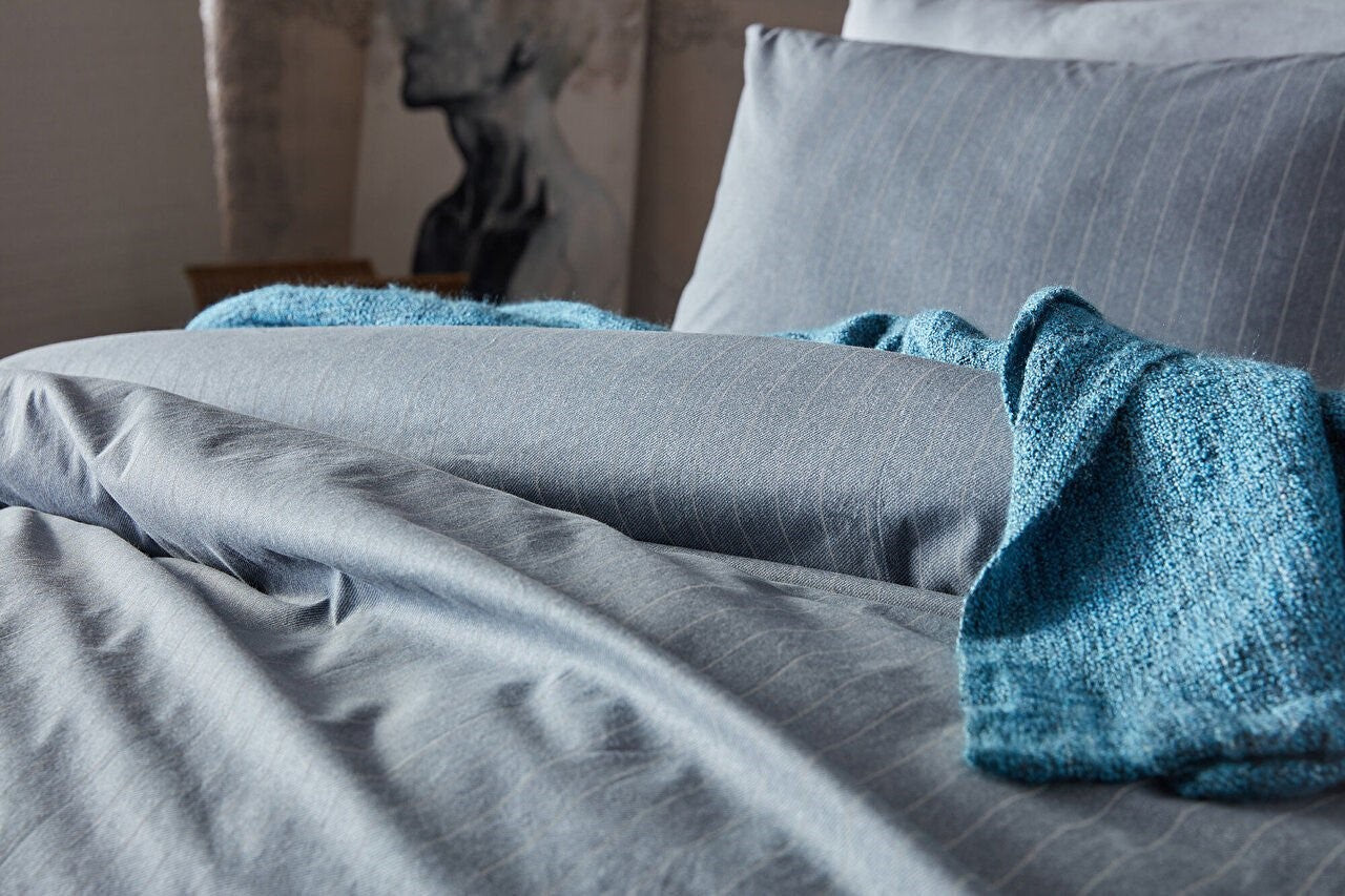 Gray duvet cover set in queen size, including a duvet cover, standard sheet, and two pillowcases.