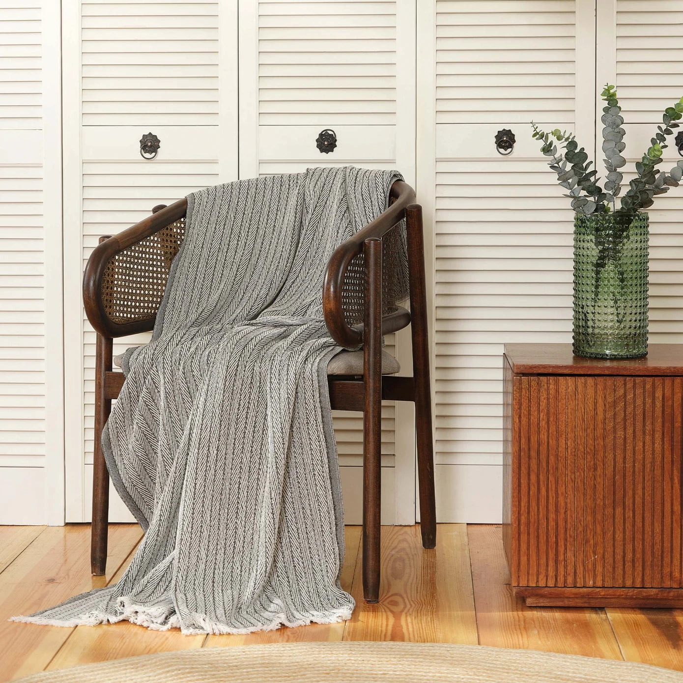 Green throw blanket with soft and cozy texture.