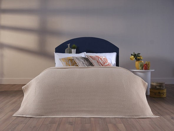 Cream-colored queen size blanket, providing warmth and comfort.