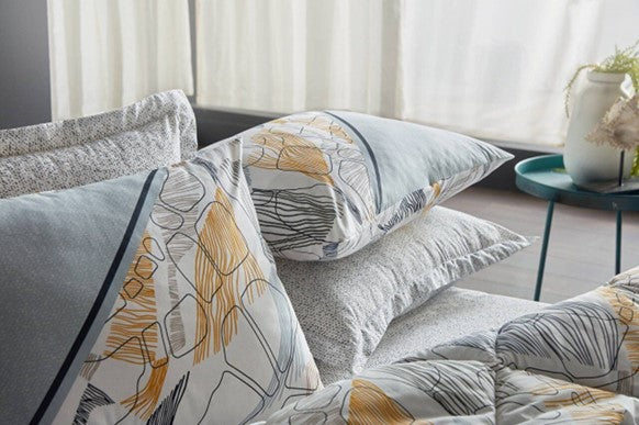 Yellow 6-piece bedding set in queen size, featuring a quilt, sheet, and four pillowcases.