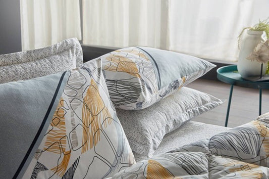Yellow 6-piece bedding set in queen size, featuring a quilt, sheet, and four pillowcases.