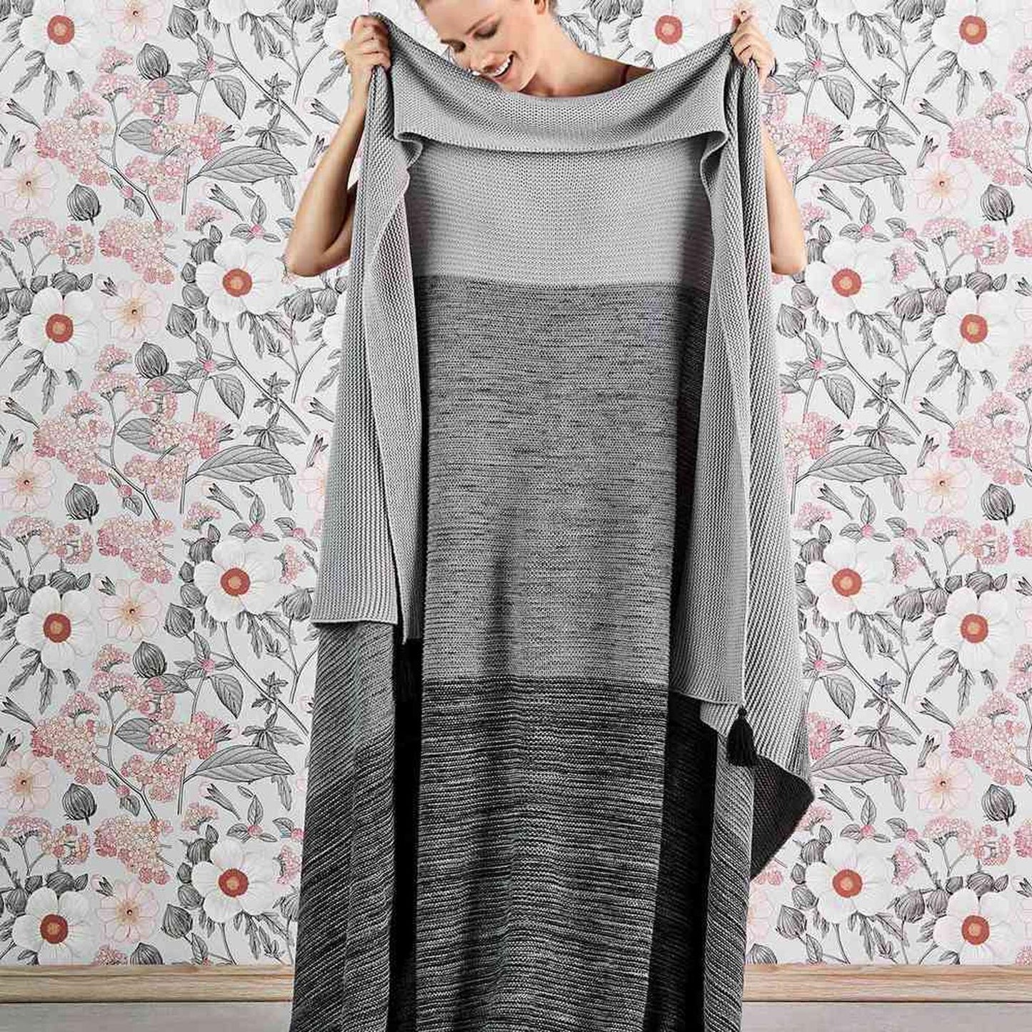 Gray bed blanket with soft and cozy texture in queen size.