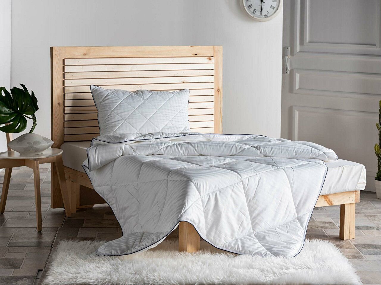 White Prestige Quilt - Queen Size, a perfect blend of comfort and style. Experience luxurious sleep with this premium quilt designed to elevate your bedding. Enjoy the softness and warmth of our meticulously crafted quilt, tailored to fit your queen size bed. Transform your bedroom into a haven of relaxation and sophistication with this exquisite quilt.