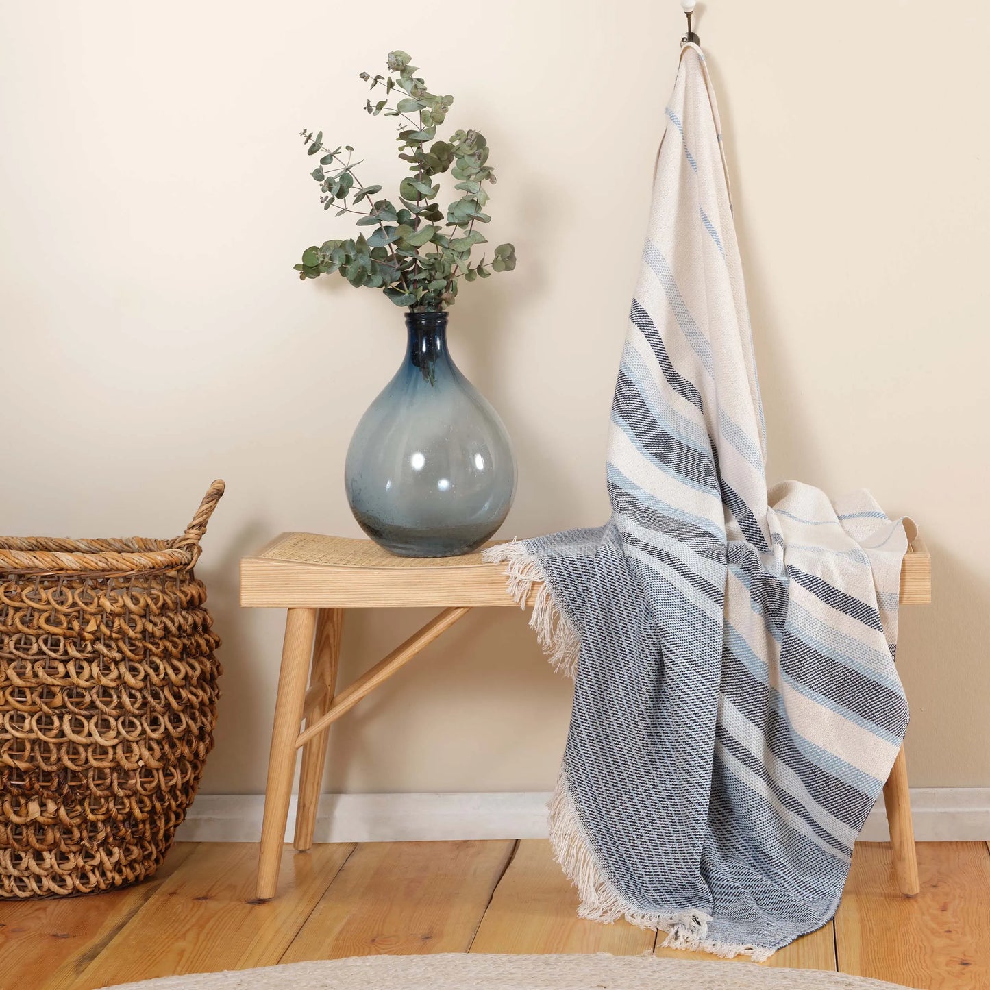 Green throw blanket with soft and cozy texture.