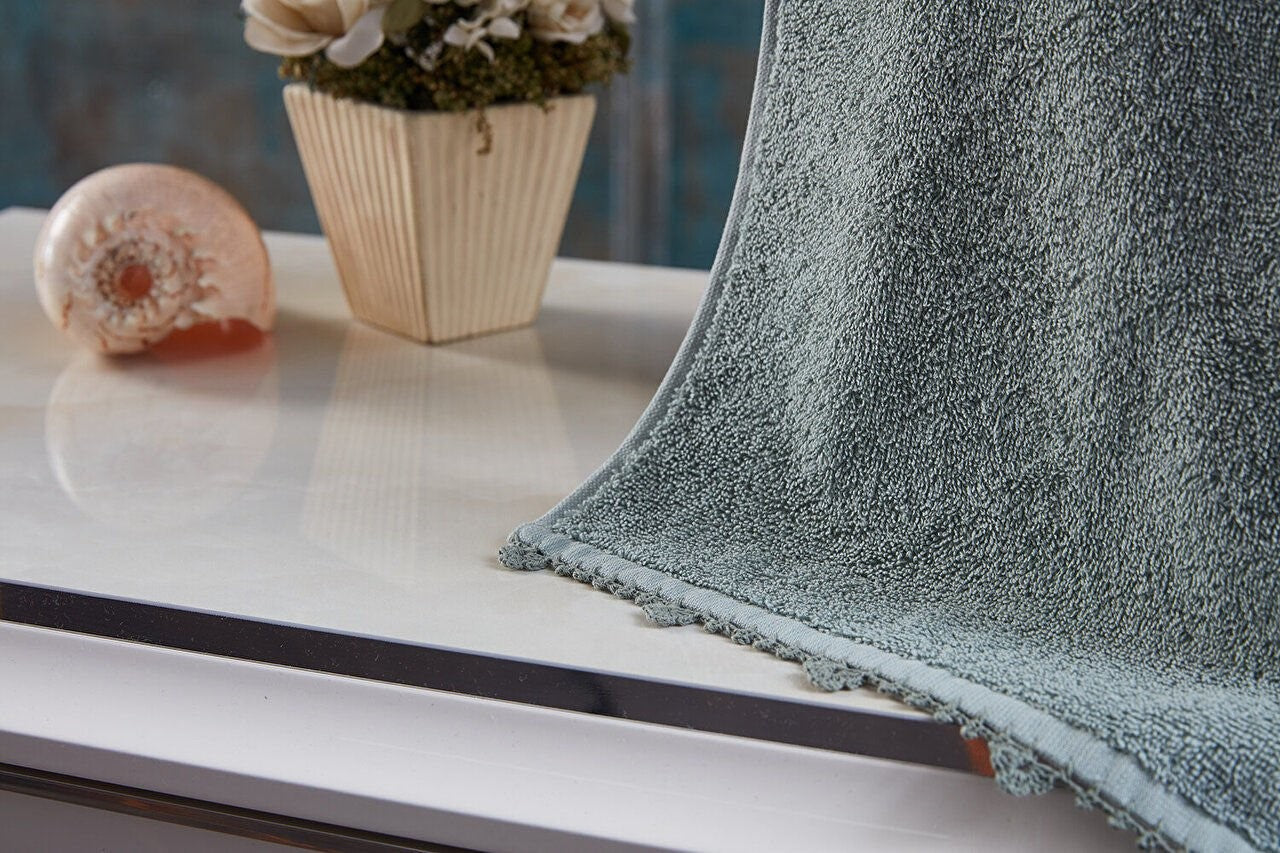 Green Hand Towel - Soft and absorbent hand towel in a refreshing shade of green, perfect for everyday use and adding a pop of color to your bathroom or kitchen.