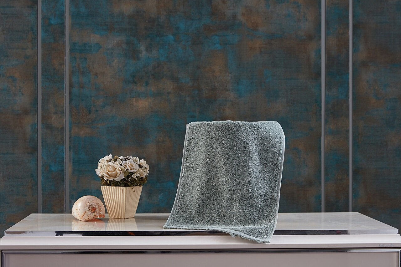 Green Hand Towel - Soft and absorbent hand towel in a refreshing shade of green, perfect for everyday use and adding a pop of color to your bathroom or kitchen.