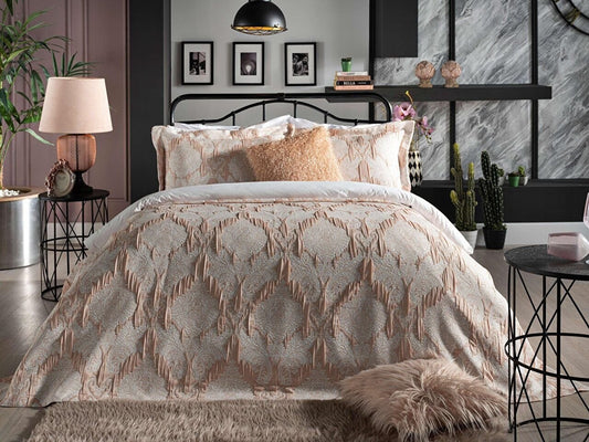 Light pink bedspread set in king size, including a bed cover and two pillowcases.