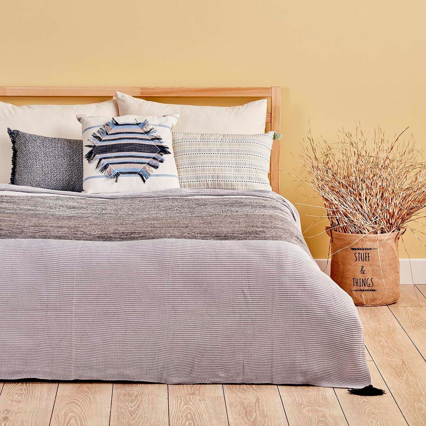 Gray bed blanket with soft and cozy texture in queen size.