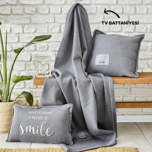 Gray throw blanket with soft and cozy texture.