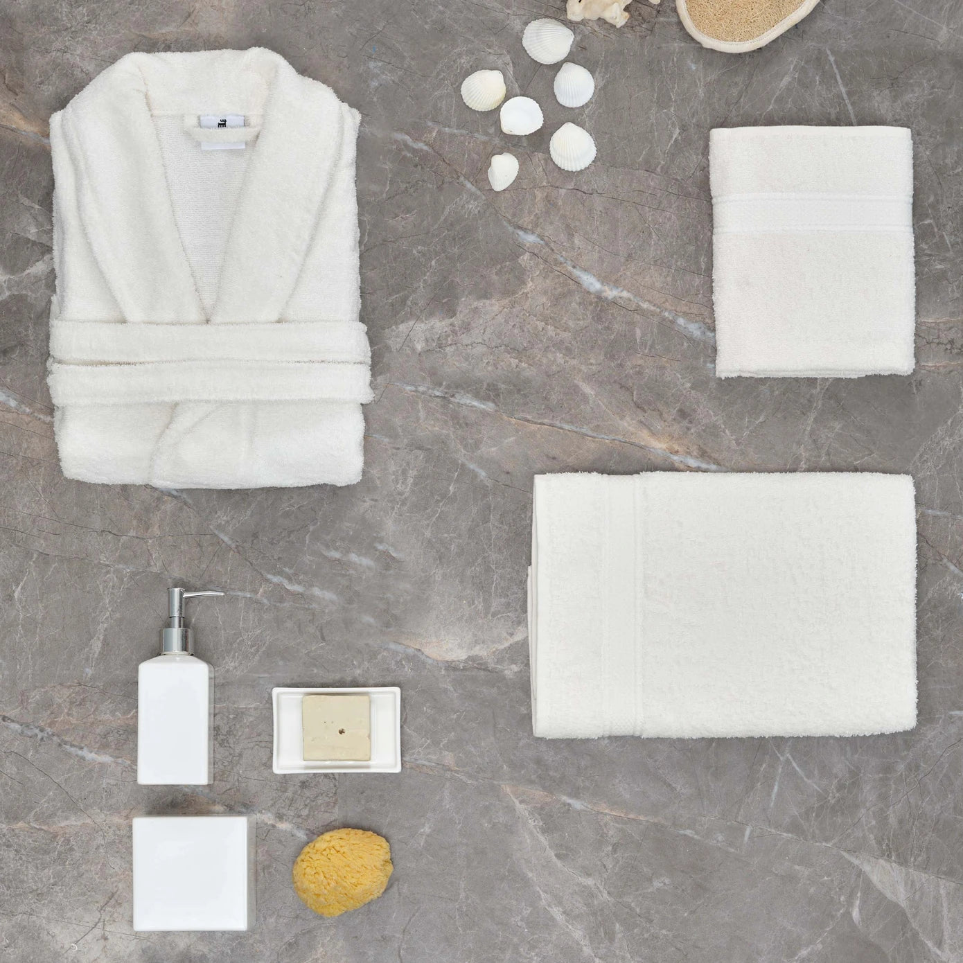 White bathrobe made from 100% cotton, providing a soft and comfortable experience.