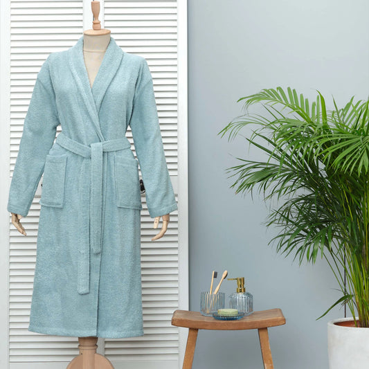 Light blue bathrobe made from 100% cotton, offering comfort and style.