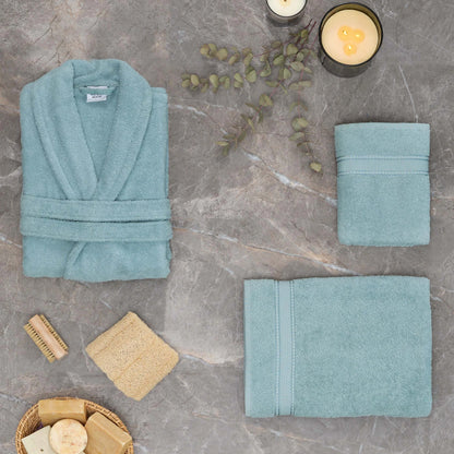 Light blue bathrobe made from 100% cotton, offering comfort and style.