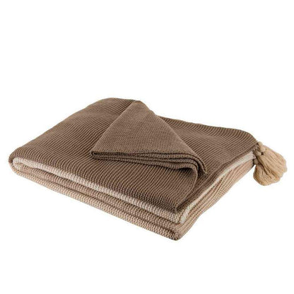 Beige bed blanket with soft and cozy texture in queen size.