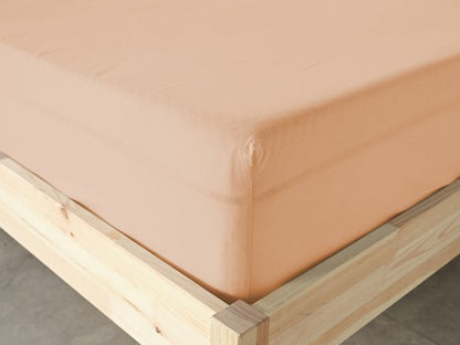 Light pink fitted bottom sheet, providing a snug and stylish fit for your bed.