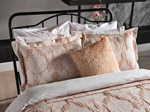Light pink bedspread set in king size, including a bed cover and two pillowcases.
