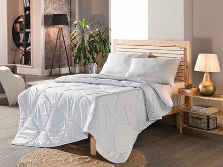 Soft and cozy cotton quilt for queen-sized beds. Perfect for a comfortable night's sleep.