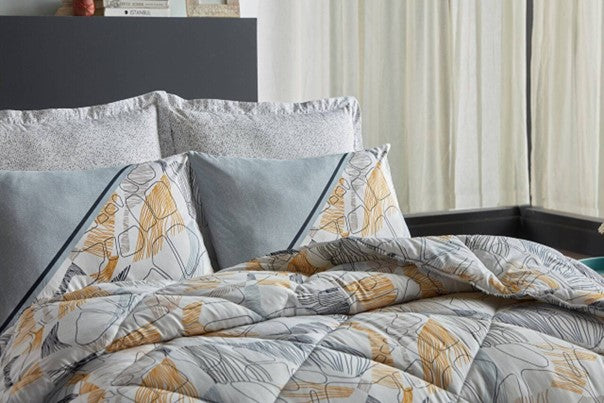 Yellow 6-piece bedding set in queen size, featuring a quilt, sheet, and four pillowcases.