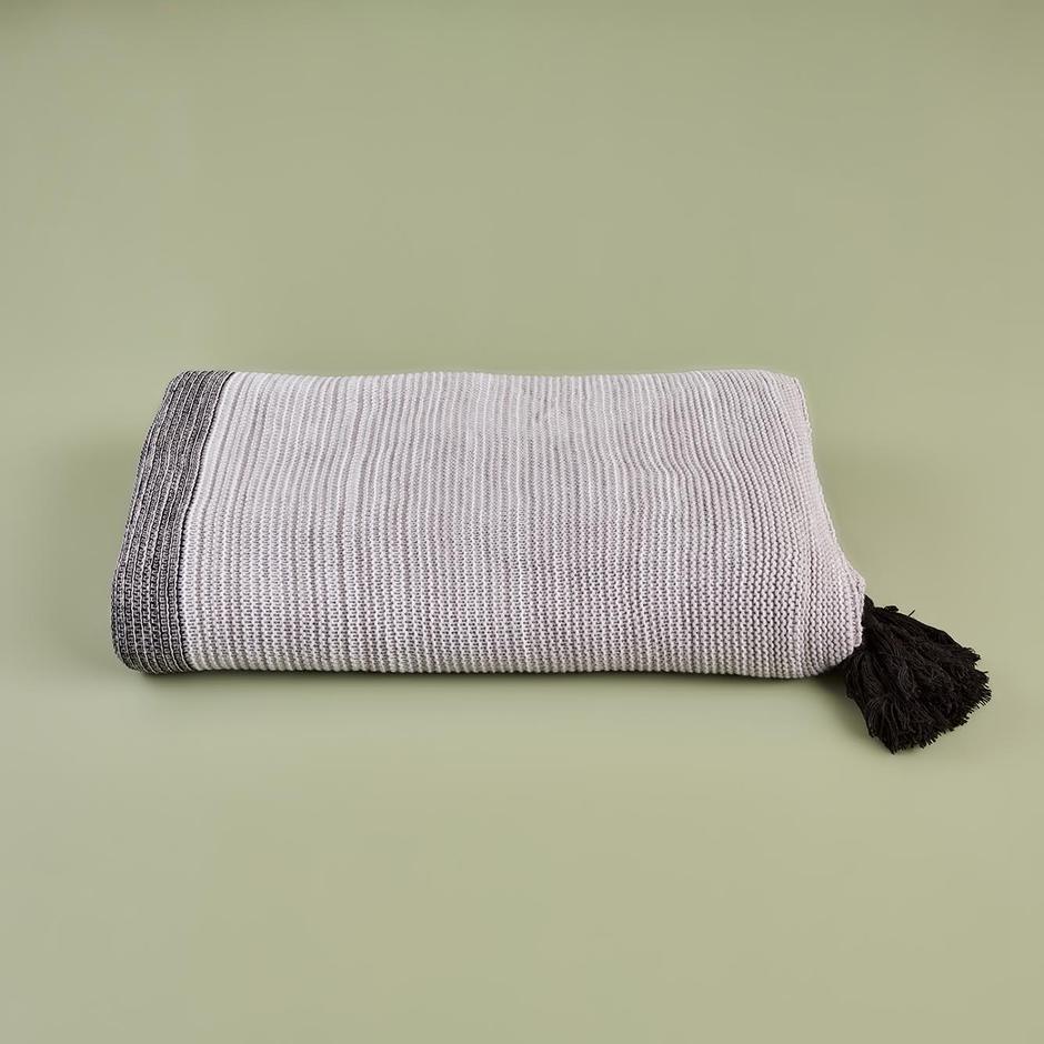 Gray bed blanket with soft and cozy texture in queen size.